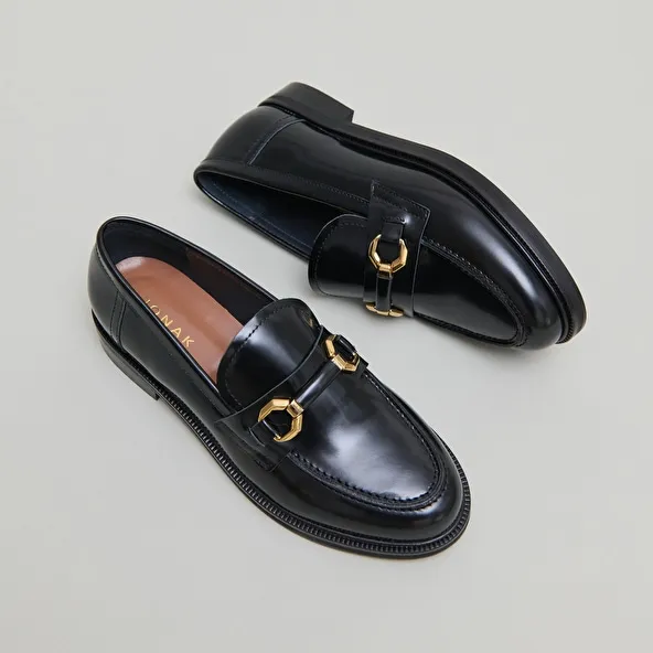 Loafers with gold bits in black glazed leather