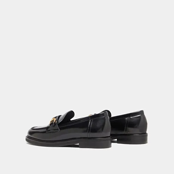 Loafers with gold bits in black glazed leather