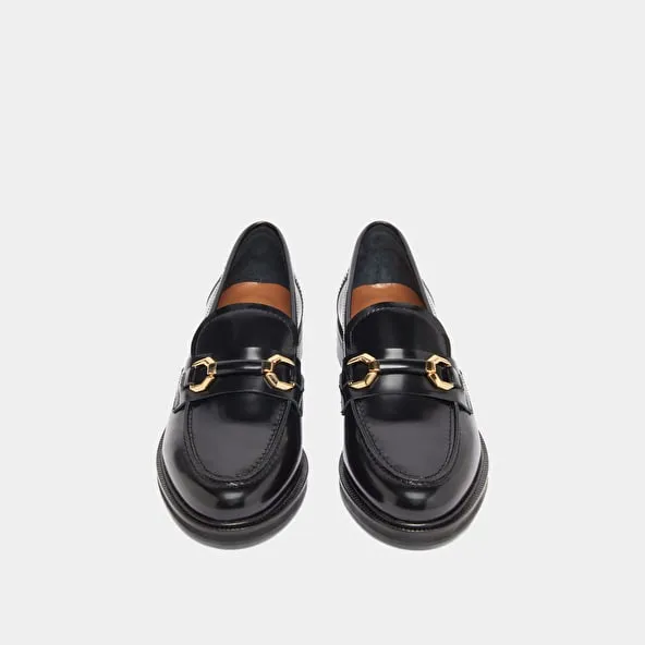 Loafers with gold bits in black glazed leather